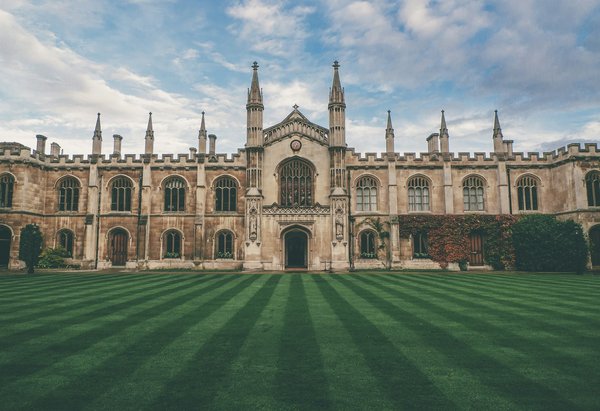 How can one save on accommodation while visiting Oxford's historic colleges?